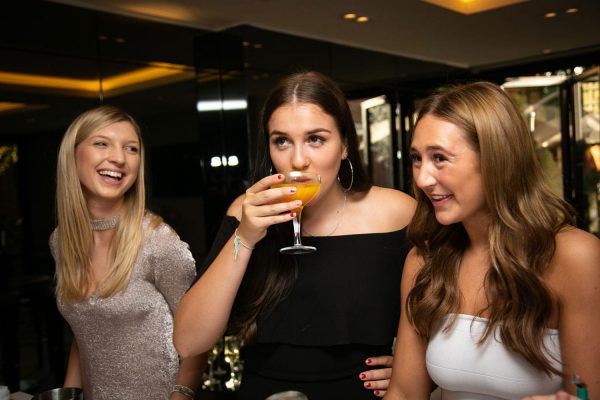 Hen party guests enjoying cocktails
