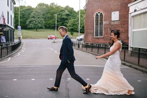 couple crossing road