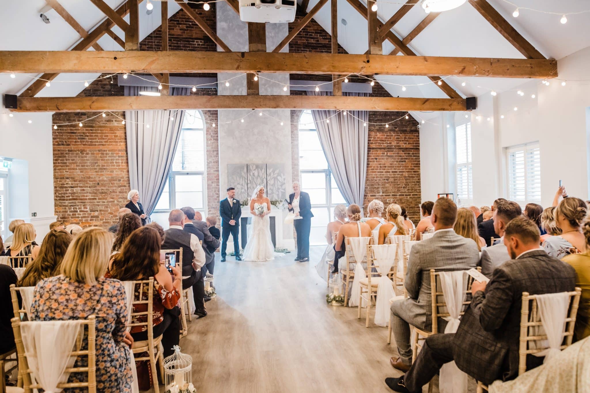 wedding set up with seated guests at one warwick park hotel