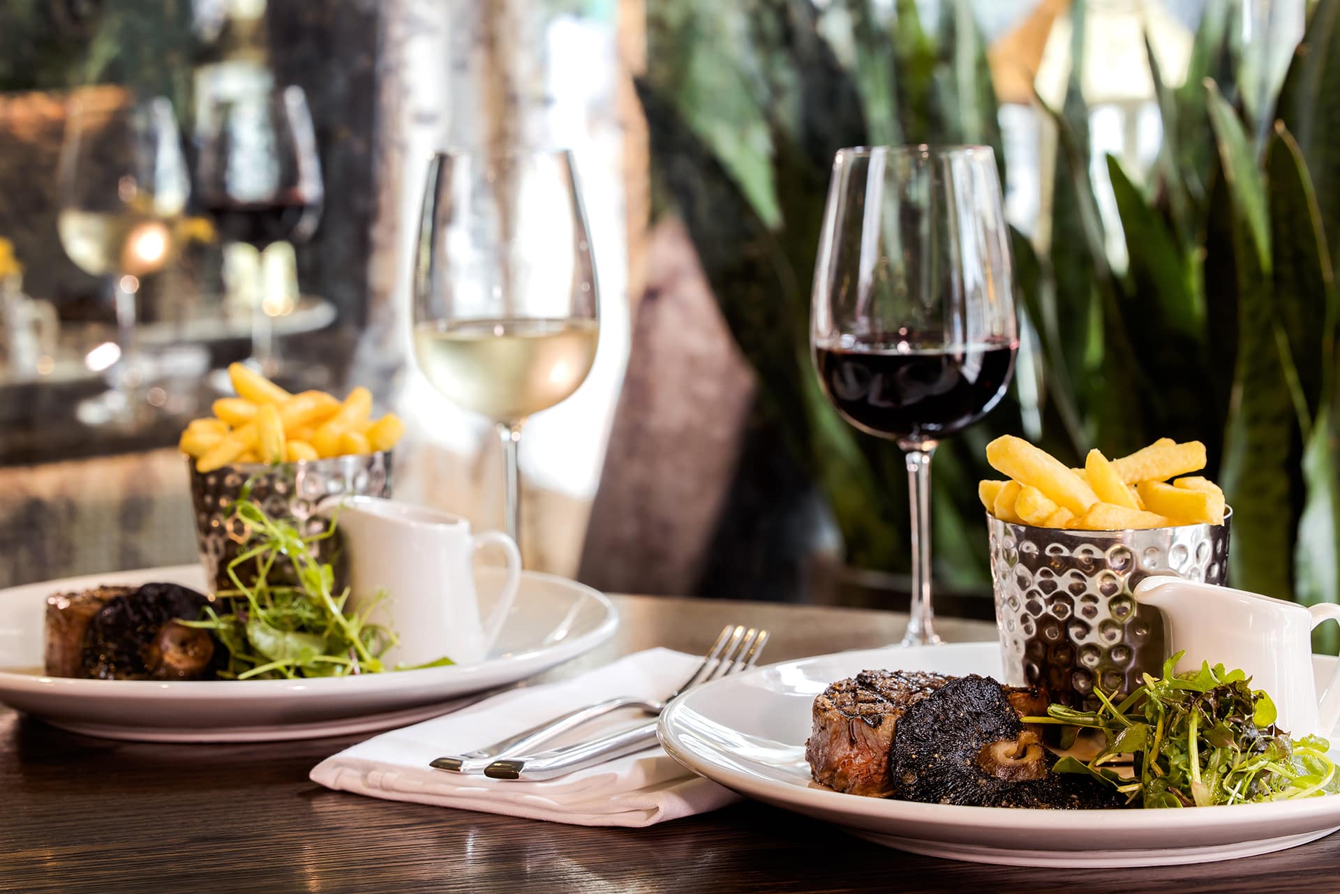 Two steaks and wine served at a restaurant in Tunbridge Wells